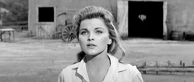 Debra Paget as Cathy Reno, surprised to see Vance Reno back from the war in Love Me Tender (1956)