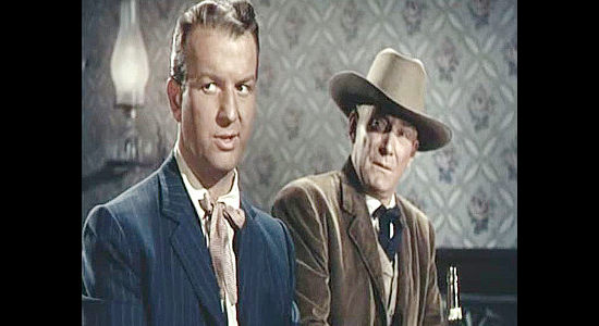 Don Porter as Denver Jones and Roy Roberts as Marshal John Tetheroe, concerned about two Texans who have shown up in Cripple Creek (1952)