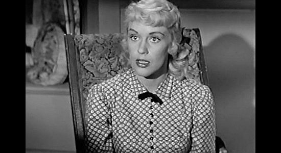 Dorothy Patrick as Edith Sawyer, a rancher's daughter secretly in love with a farmer in The Peacemaker (1956)