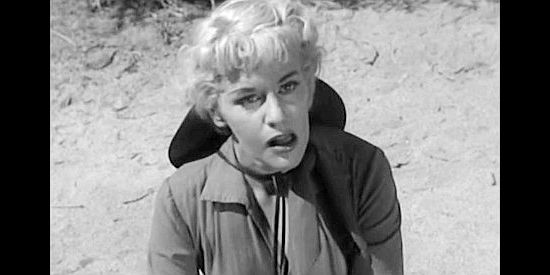 Dorothy Patrick as Murdock, surprised when a familiar face shows up in Thunder Pass (1954)