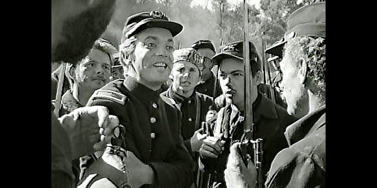 Douglas Dick as the lieutenant, celebrating a Rebel retreat with his men in The Red Badge of Courage (1951)