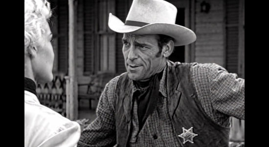 Drake Smith as Bill Foster, sporting a marshal's badge and informing Queenie Hart he'll have to step down as her foreman in Cattle Queen (1951)