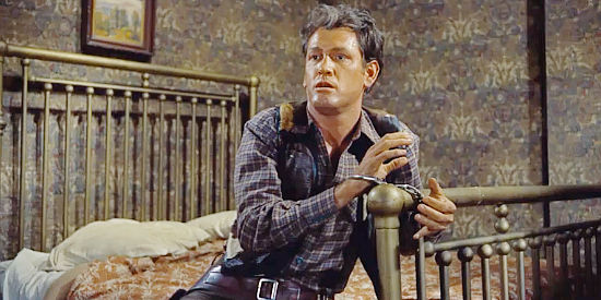 Earl Holliman as Rick Belden, surprised to find himself in Marshal Morgan's custody in Last Train from Gun Hill (1959)