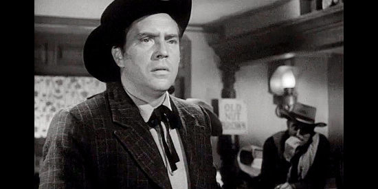 Edmond O'Brien as Dunn Jeffers, a Union agent posing as a cattle buyer in The Redhead and the Cowboy (1951)