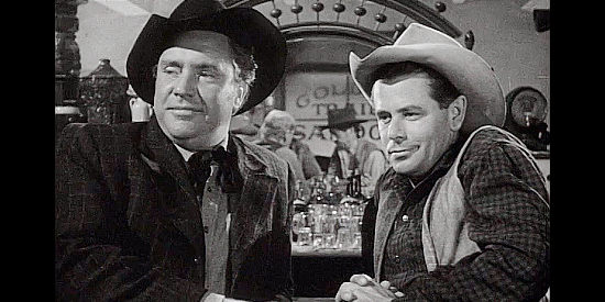 Edmund O'Brien as Dunn Jeffers and Glenn Ford as Gil Kyle, spotting a pretty redheaded saloon girl in The Redhead and the Cowboy (1951)