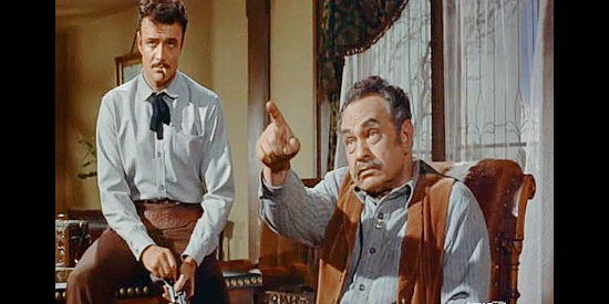 Edward G. Robinson as Lew Wilkison, making John Parrish an offer for his land while brother Cole (Brian Keith) looks on in The Violent Men (1955)