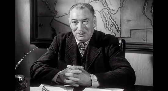 Edward Keane as Arizona land surveyor, about to be shocked by James Reavis's claim in The Baron of Arizona (1950)