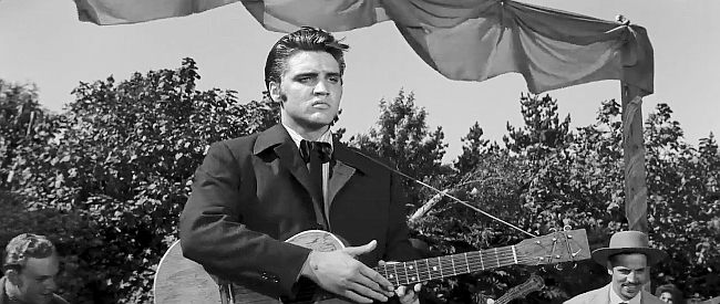 Elvis Presley as Clint Reno, sensing trouble between Vance and Cathy in Love Me Tender (1956)
