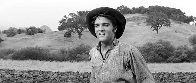 Elvis Presley as Clint Reno, thrilled to see his brothers returning home from war in Love Me Tender (1956)