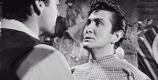 Eugene Inglesias as Juan Cortez, reluctant to give Domino the name of the fifth name in The Domino Kid (1957)