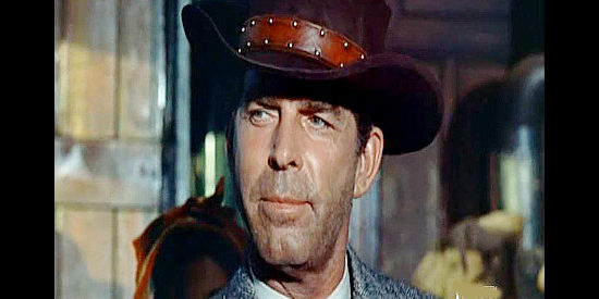 Fred MacMurray as Jim Larsen, a man on the run and contemplating a name change in Face of a Fugitive (1959)