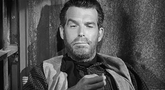 Fred MacMurray as Wes Anderson, awaiting his fate in a jail cell in The Moonlighter (1953)