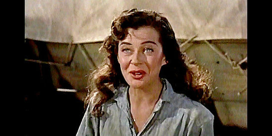Gail Russell as Annie Greer, explaining to Ben Stride that she and her husband are from back East in Seven Men from Now (1956)