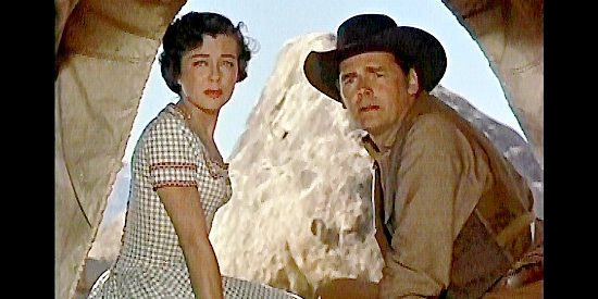Gail Russell as Annie Greer nd Walter Reed as her husband John, settlers Ben Stride decides to help in Seven Men from Now (1956)