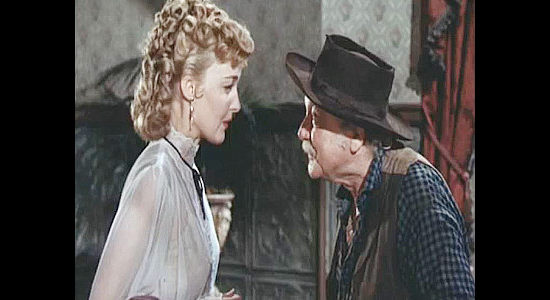 George Cleveland as Hardrock Hanson telling daughter Julie (Karin Booth) about the gold ore he found dumped at his mine in Cripple Creek (1952)