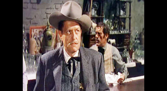 George Eldredge as Sheriff Charle Webb, one of the lawman on John Wesley's trail in The Lawless Breed (1953)