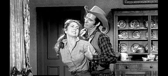 George Keymas as Rink Witter, trying to bend Angie Kinyon (Susan Cummings) to his will in Utah Blaine (1957)