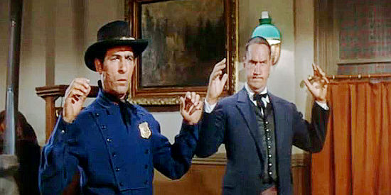 George Keymas as Sgt. Price and Ainslie Pryor as Capt. Follyard, reconstructionists mistreating Texans until they're on the verge of revolt in Cole Younger, Gunfighter (1958)