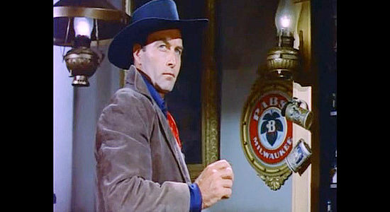 George Montgomery as Dan Barton, arriving in Gallatin for his undercover assignment in Last of the Badmen (1957)