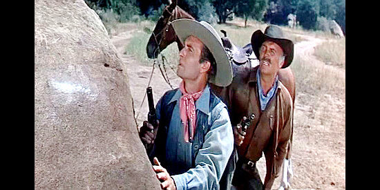 George Montgomery as Dan Beattie and Gregg Barton as Col. Miller, wondering who took a shot at the former in The Man from God's Country (1958)