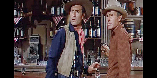 George Montgomery as Dan Beattie and House Peters Jr. as Curt Warren have their reunion interrupted in The Man from God's Country (1958)