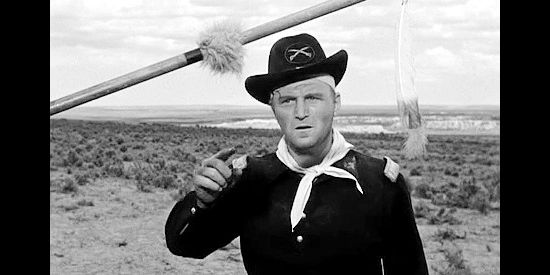 George Neise as Lt. Davenport, delirious and trying to file a complaint with a dead superior officer in Tomahawk Trail (1957)