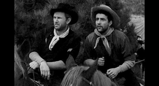 George Wallace as Meade and Rick Vallin as Slim, trouble makers among the trail crew in The Homesteaders (1953)