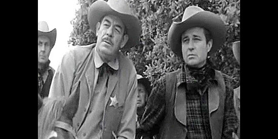 Glenn Strange as the sheriff and Jim Davis as railroad man Bill Cameron, on the trail of the bandits in The Last Stagecoach West (1957)