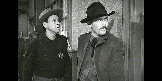 Gregory Peck as Johnny Ringo, with Deputy Charlie Norris (Anthony Ross), spotting trouble in The Gunfighter (1950)