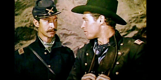 Guy Madison as Maj. Will Denning, complaining about not having the artillery needed to chase the Rebs off Devil Mountain in Drums in the Deep South (1951)