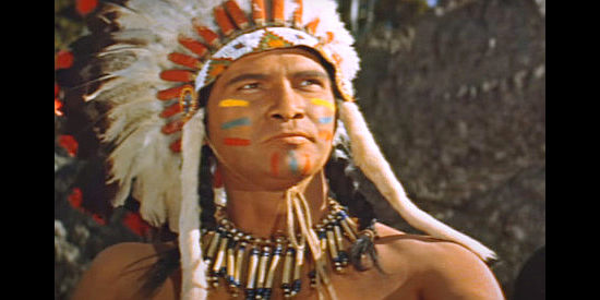 H.M. Wynant as Black Eagle, just waiting for the right time to attack the fort in Oregon Passage (1958)