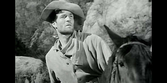Hugh O'Brian as Pvt. Al DeWalt, a trooper who volunteers for a dangerous scout in Little Big Horn (1951)