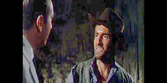 Hugh O'Brien as Garth, chief henchman for Ben Cross, the money man in Cooper Bend in Cave of Outlaws (1951)