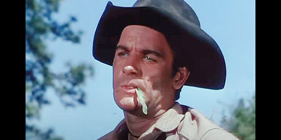 James Best as Bitter Creek, taking offense to Red Buck's comment about Cimarron Rose in The Cimarron Kid (1952)