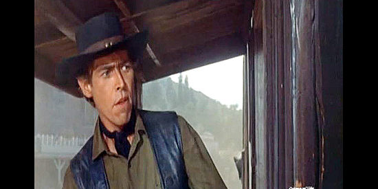 James Coburn as Purdy, Reed Williams' fast gun, trying to track down Jim Larsen during a gunfight in Face of a Fugitive (1959)