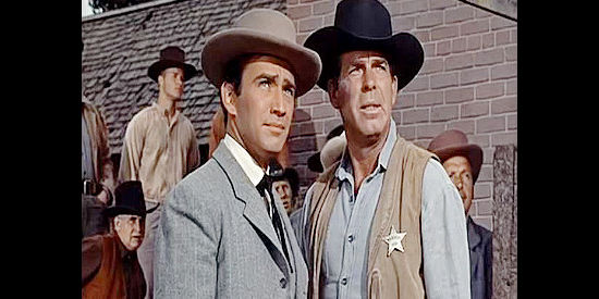 James Drury as Dr. Paul Ridgely and Fred MacMurray as Marshal Ben Cutler, watching the gallows go up in Good Day for a Hanging (1959)