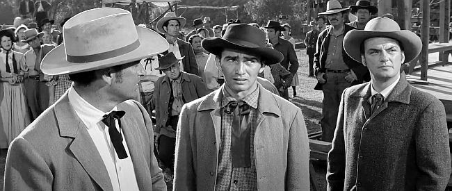 James Drury as Ray Reno and William Campbell as Brett Reno, denying any knowledge of a payroll robbery in Love Me Tender (1956)