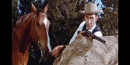 James Griffith as Mark Faber, Santee's henchman, setting an ambush for Dan Beattie in The Man from God's Country (1958)