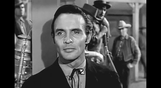 James Mitchell as Parson Butler, arriving in the town Pembroke in The Peacemaker (1956)