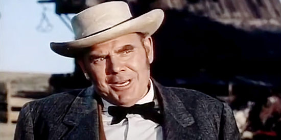 James Westerfield as Birm Bates, offering a handsome price for Lance, the Chandlers' sheepdog, in The Proud Rebel (1958)