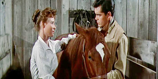 Janice Rule as Aud Niven and Jeffrey Hunter as Bless Keough, growing closer as time passes in Gun for a Coward (1956)