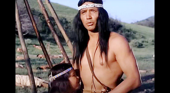 Jay Silverheels as Chingachgook, coming across a massacred Mohican village and finding only son Uncas still alive in The Pathfinder (1952)