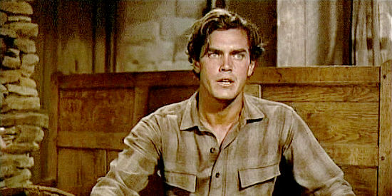 Jeffrey Hunter as Martin Pawley, feeling a need to stay by Ethan's side in The Searchers (1956)