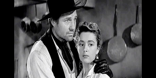 Jim Davis as Dean Cannary, trying to stake claim on Anita Valdez (Anna Maria Alberghetti) in Duel at Apache Wells (1957)