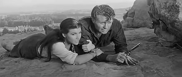 Jim Davis as Ralph Carpenter, on the run from Sheriff Carl Brandon with pretty Indian girl Irene (Mara Corday) in The Quiet Gun (1957)