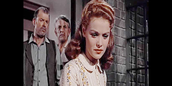 Joan Blackman as Laurie Cutler, sympathizing with Eddie Campbell as deputies Avery (Phil Chambers) and Moore (Denver Pyle) look on in Good Day for a Hanging (1959)