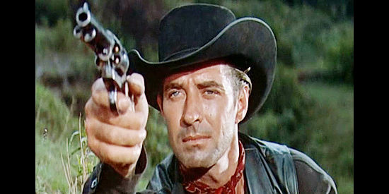 Jock Mahoney as Brad Ellison, on what he hopes will be his last job as a hired gun in The Last of the Fast Guns (1958)