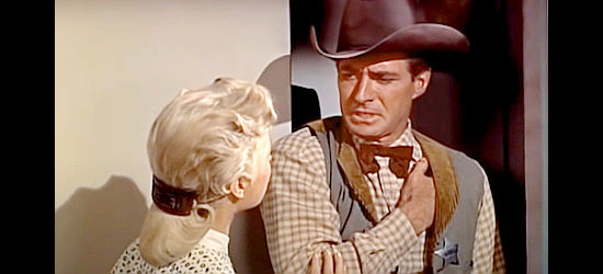 Jock Mahoney as Jim Trask, wounded and running into Peggy Bigalow (Martha Hyer) in Showdown at Abilene (1956)