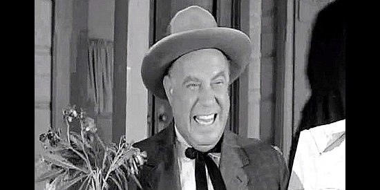Joe Besser as Andy Heather, welcoming his mail-order bride to town in Plunderers of Painted Flats (1959)