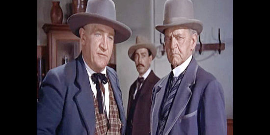 Joe Sawyer as Tom Biggert and Richard Garrick as Walters, town leaders who doubt Larry Delong's claims in Riding Shotgun (1954)